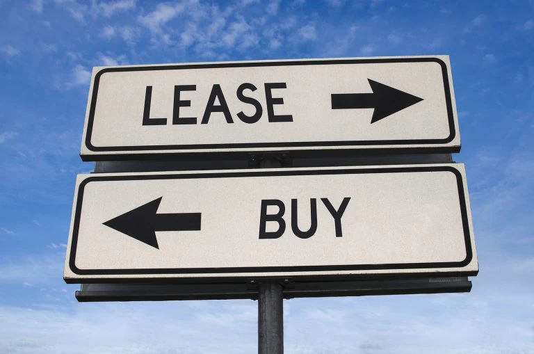 Street sign showing lease or buy